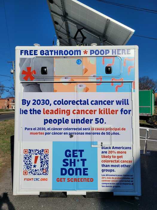 Signage outside a mobile display for fight colorectal cancer.